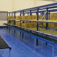 A carton live/ gravity flow storage shelving system installed in an industrial warehouse by Teepee