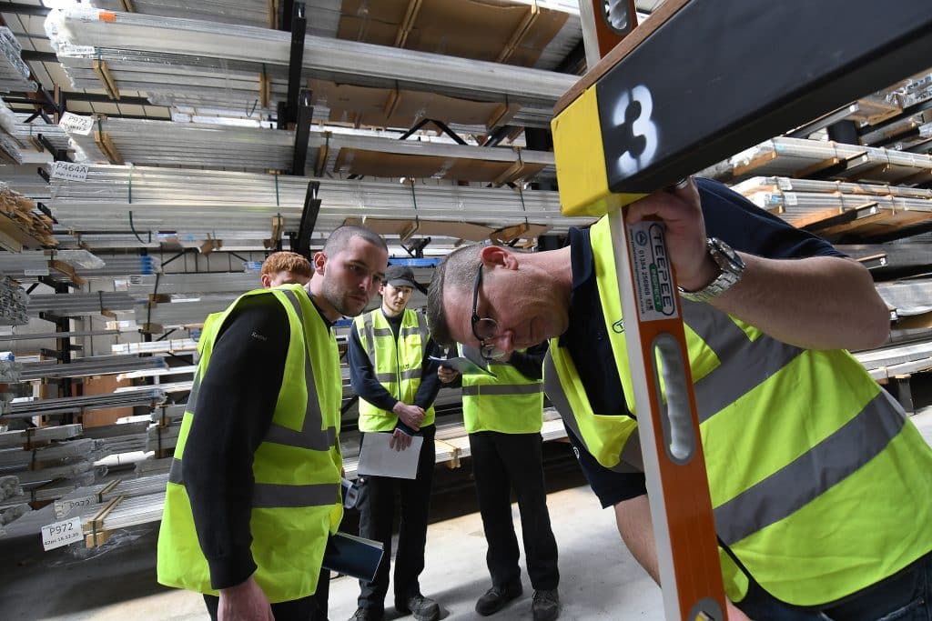 Teepee racking inspectors inspecting ecommerce warehouse storage equipment