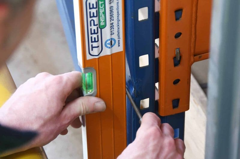 storage-equipment-inspections-teepee-materials-handling A Teepee Materials Handling spirit level being used to complete a pallet racking inspection in a Birmingham warehouse